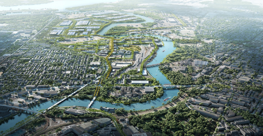 Aerial view of urban area with waterways, green spaces, and mixed residential and commercial buildings.